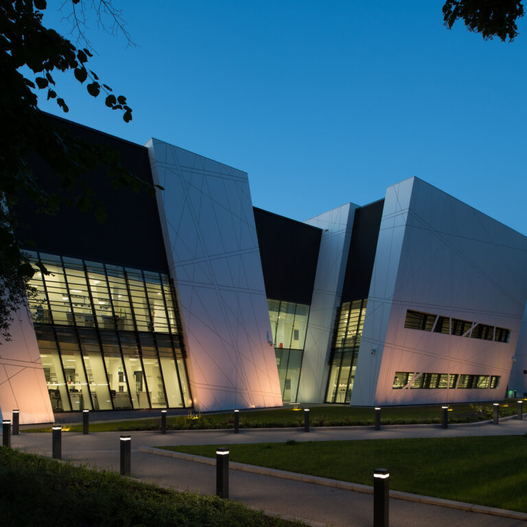 Exterior of the Oglesby Cancer Research Building at nighttime