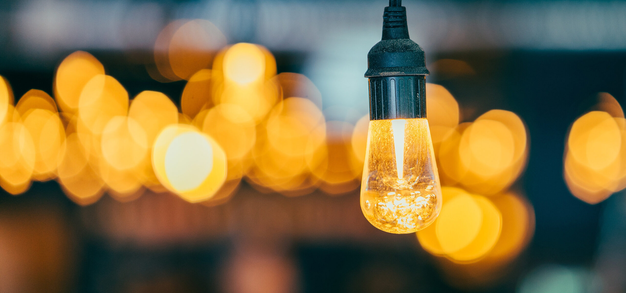 Light bulb against dark background