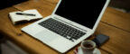 Laptop and notepad on a desk