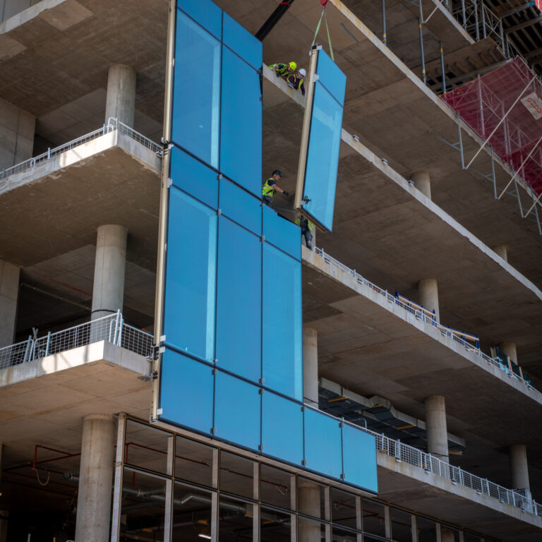 Glass panels being installed at the Paterson Redevelopment Project in Withington