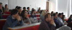 Audience members listening to speakers at the 2022 PGR Showcase