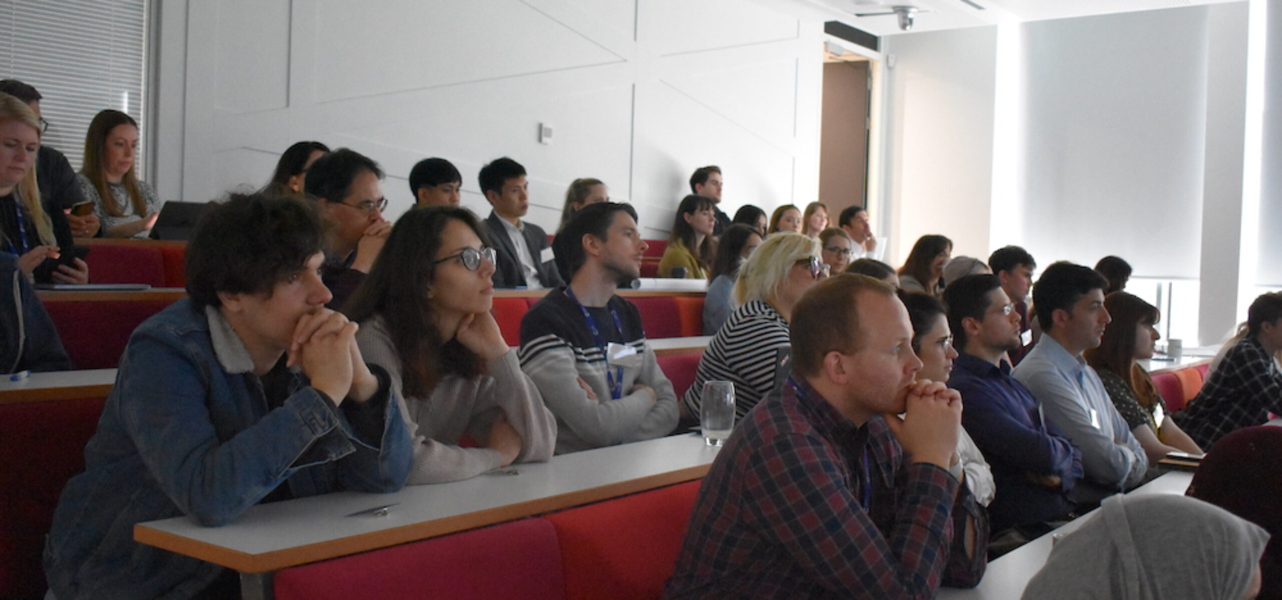 Audience members listening to speakers at the 2022 PGR Showcase