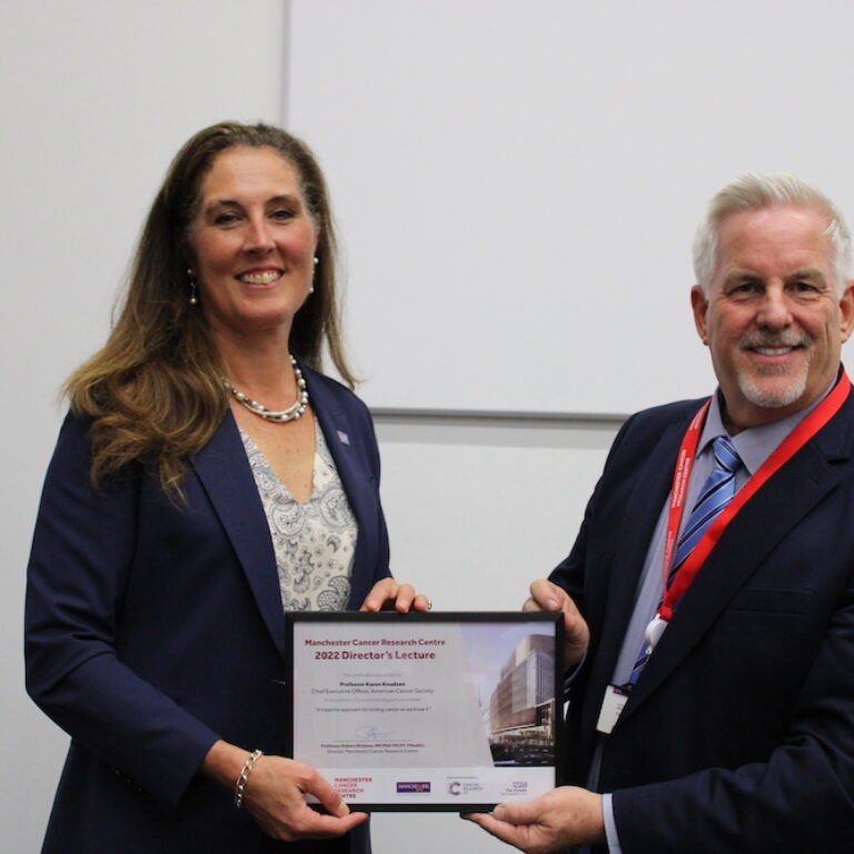 Robert Bristow presenting Karen Knudsen with an MCRC Director's Lecture certifciate