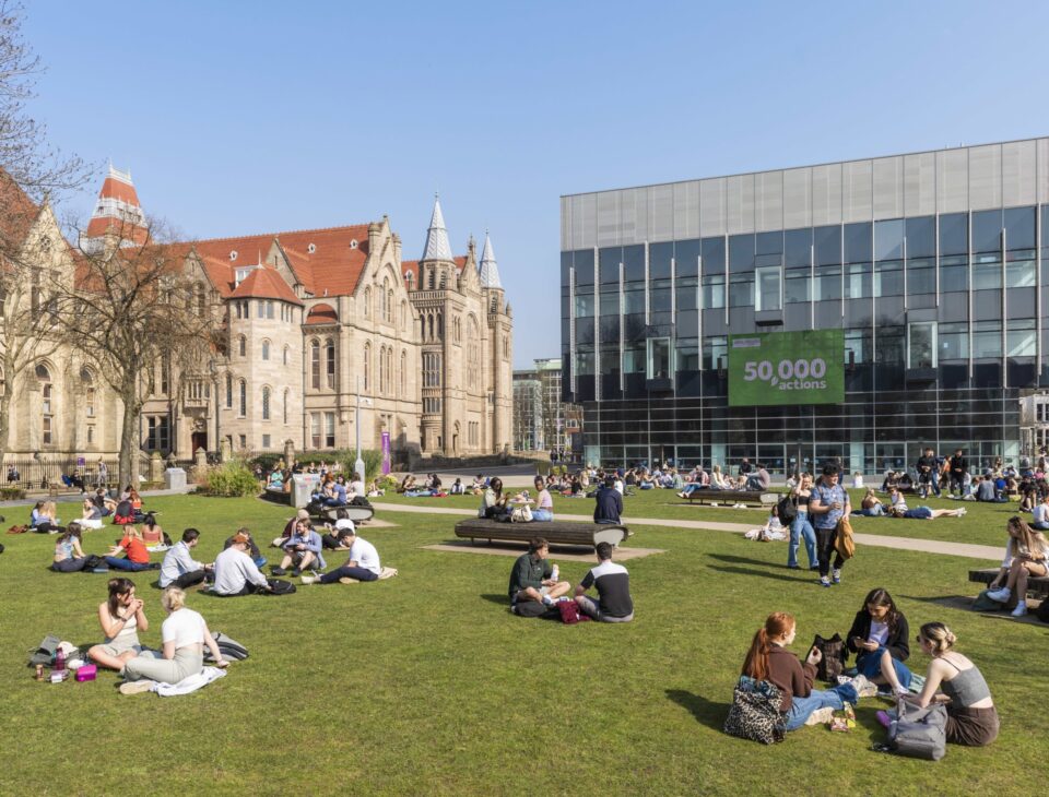 Students relaxing on the main UoM campus