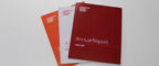 Three issues of the MCRC Annual Report stacked on top of each other with 2022/2023 issue on top