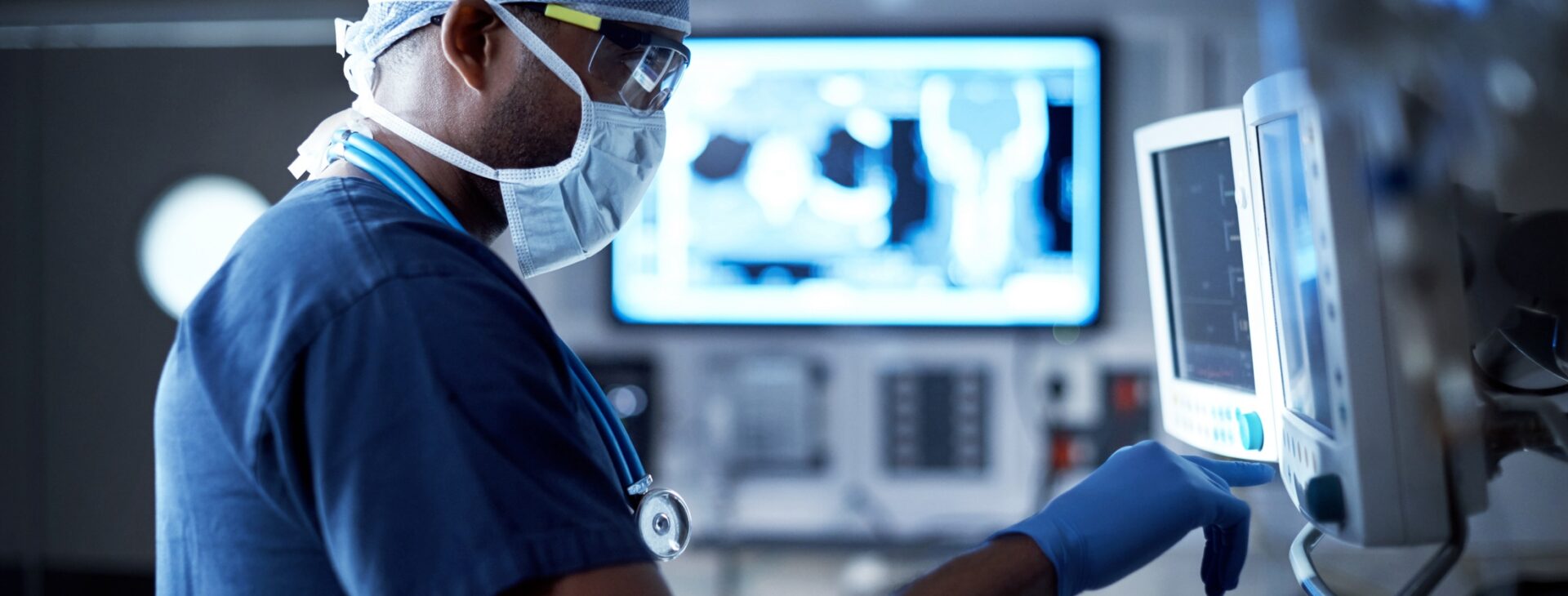 Vigilantly monitoring his patient's vitals