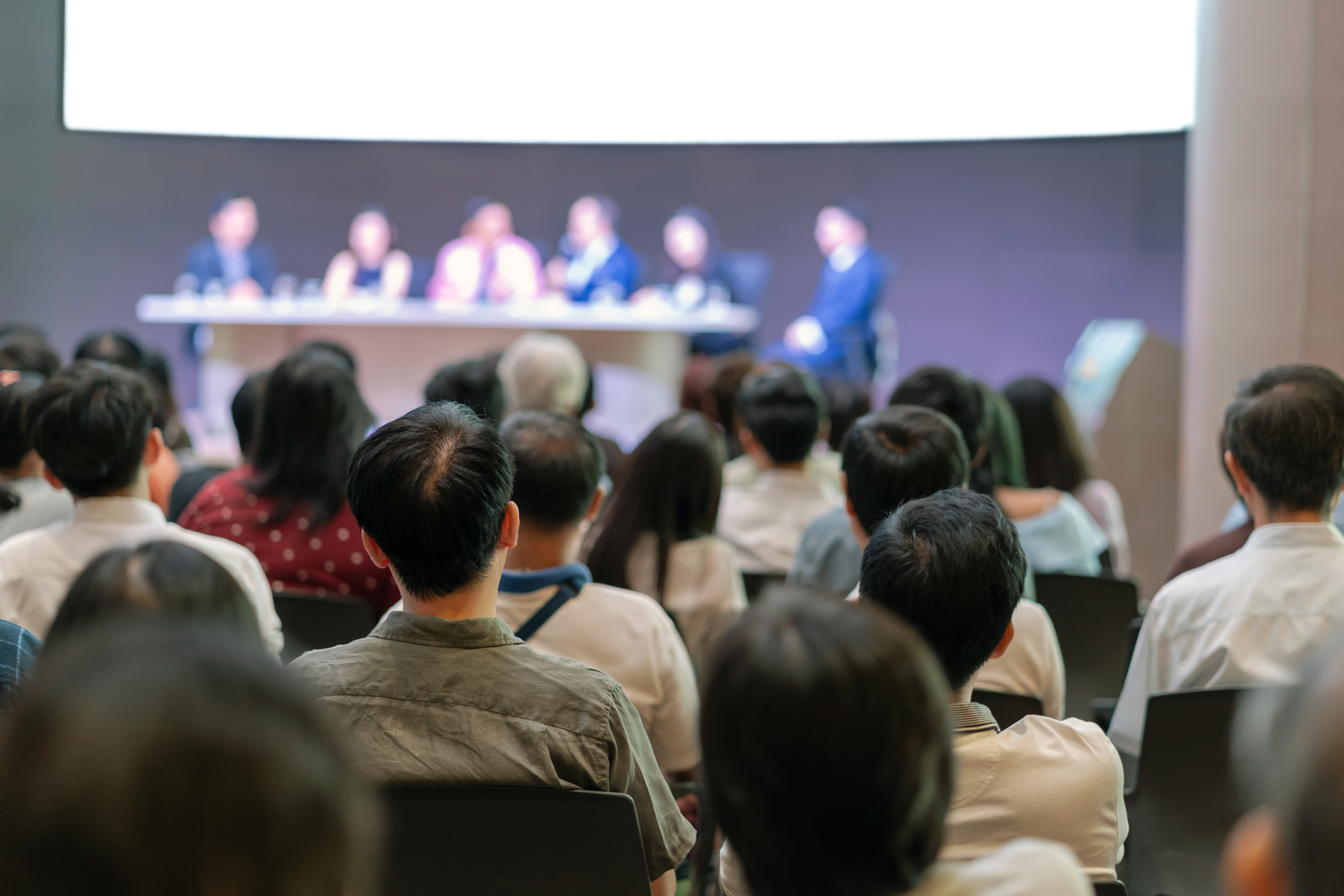 Rear view of Audience in the conference hall or seminar meeting