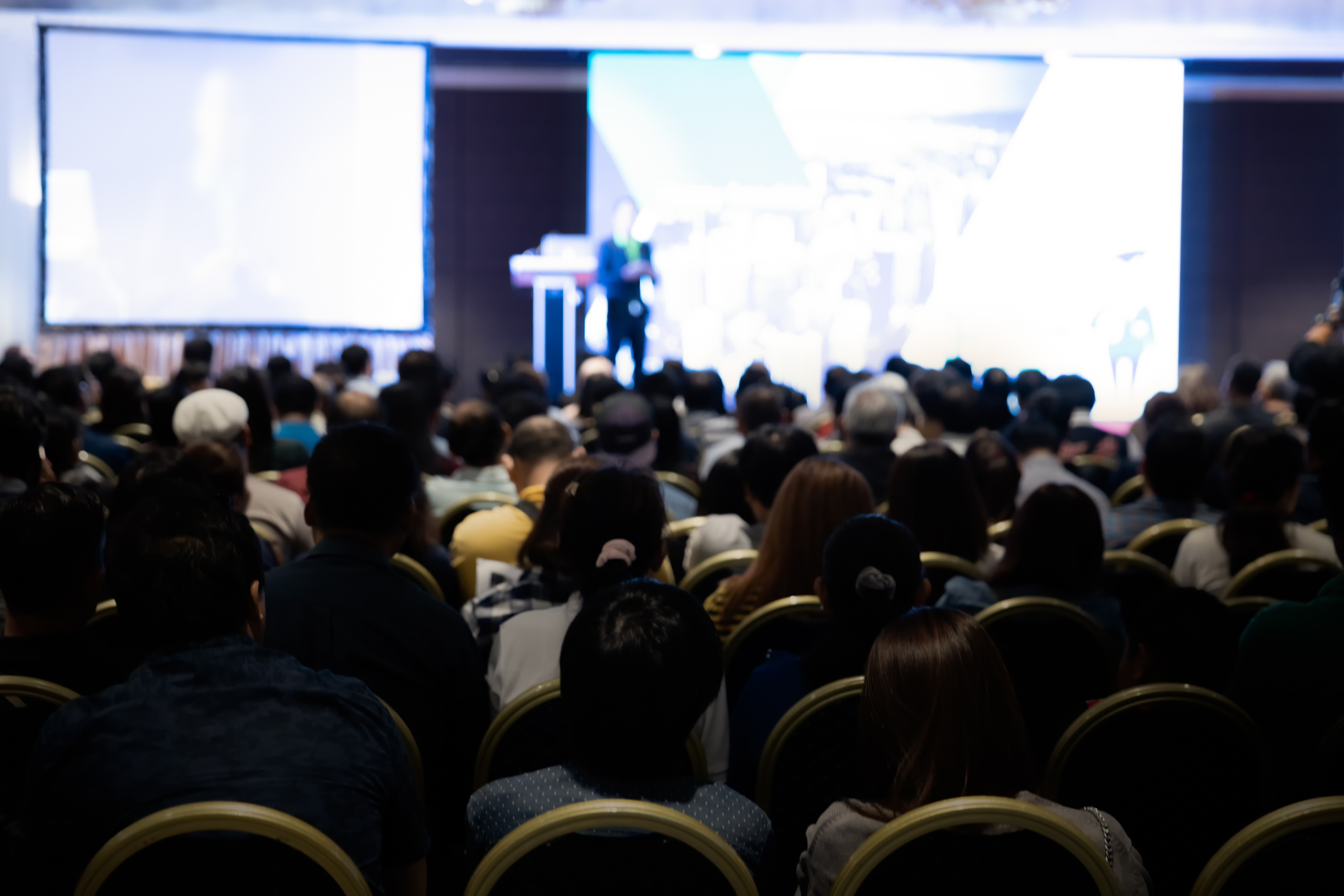 Rear view of the people in the conference hall.