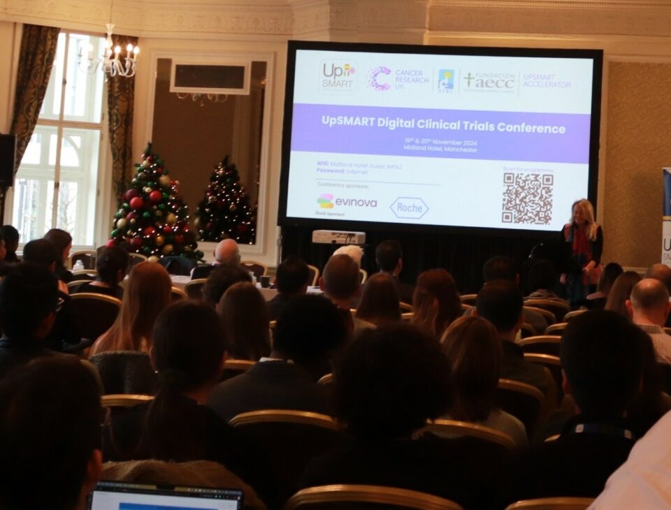 Prof Caroline Dive presenting at the UpSMART Accelerator Award conference in front of attendees