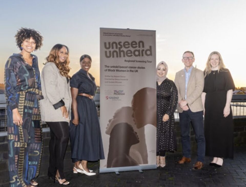 The Unseen Unheard organising committee on the balcony at The Lowry.
