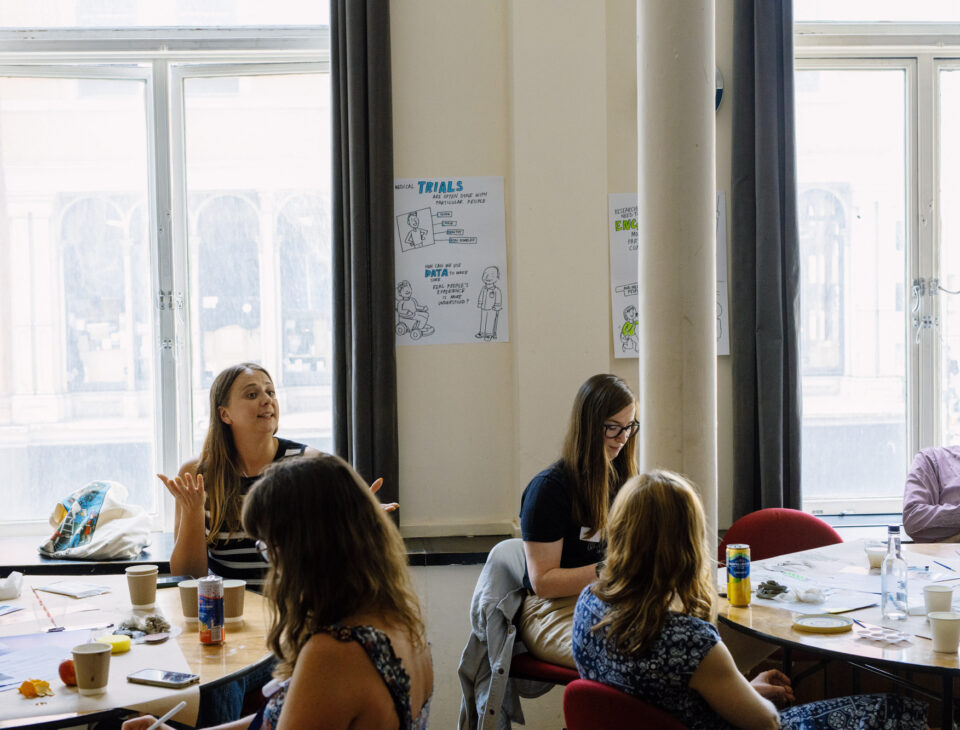Woman speaking and 3 other women listening